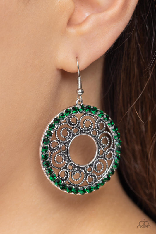 Whirly Whirlpool Green Rhinestone Earring - Paparazzi Accessories  Bordered in a ring of glittery green rhinestones, a rustic silver hoop is filled with whirly silver filigree for a wistful finish. Earring attaches to a standard fishhook fitting.  Sold as one pair of earrings.  P5RE-GRXX-170XX