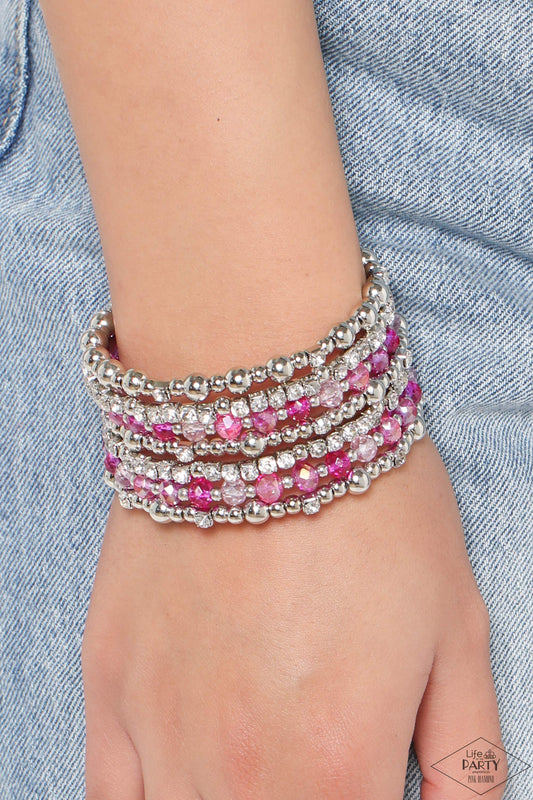 ICE Knowing You Pink Coil Bracelet - Paparazzi Accessories  An icy collection of silver beads, cubes, opaque crystals in various pink shades, and glassy white rhinestones are threaded along a coiled wire, creating a blinding infinity wrap style bracelet around the wrist.  Sold as one individual bracelet.  P9RE-PKXX-324XX