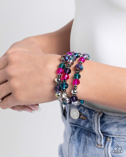 Stack of GLASS Multi Stretch Bracelet - Paparazzi Accessories Infused along elastic stretchy bands, a collection of highly-faceted multicolored beads in various shades and silver and gunmetal beads stack along the wrist for a pop of color. Sold as one set of three bracelets. SKU: P9RE-MTXX-160XX