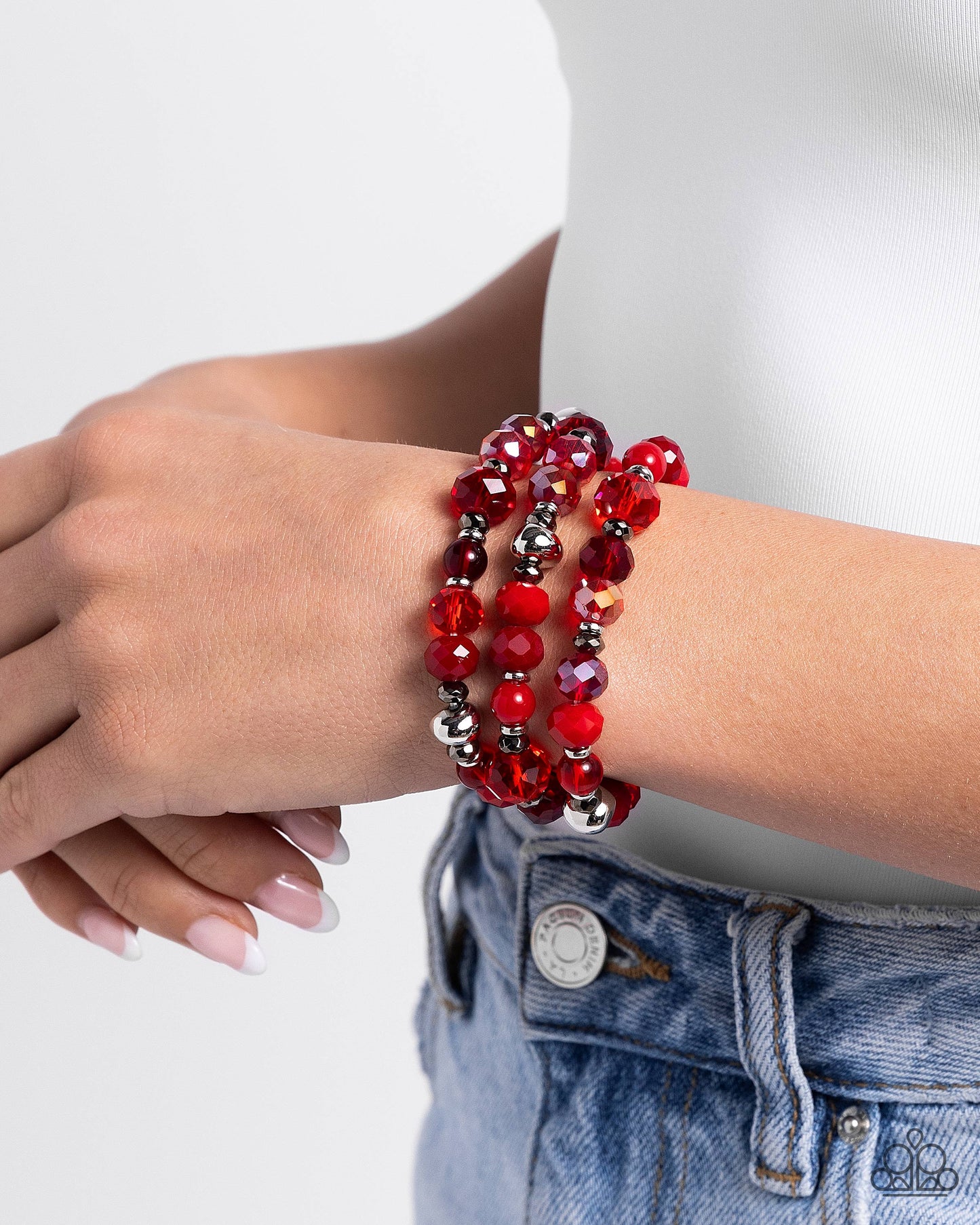 Stack of GLASS Red Stretch Bracelet - Paparazzi Accessories  Infused along elastic stretchy bands, a collection of highly-faceted red beads in various shades and silver and gunmetal beads stack along the wrist for a pop of color.  Sold as one set of three bracelets.  P9RE-RDXX-134XX