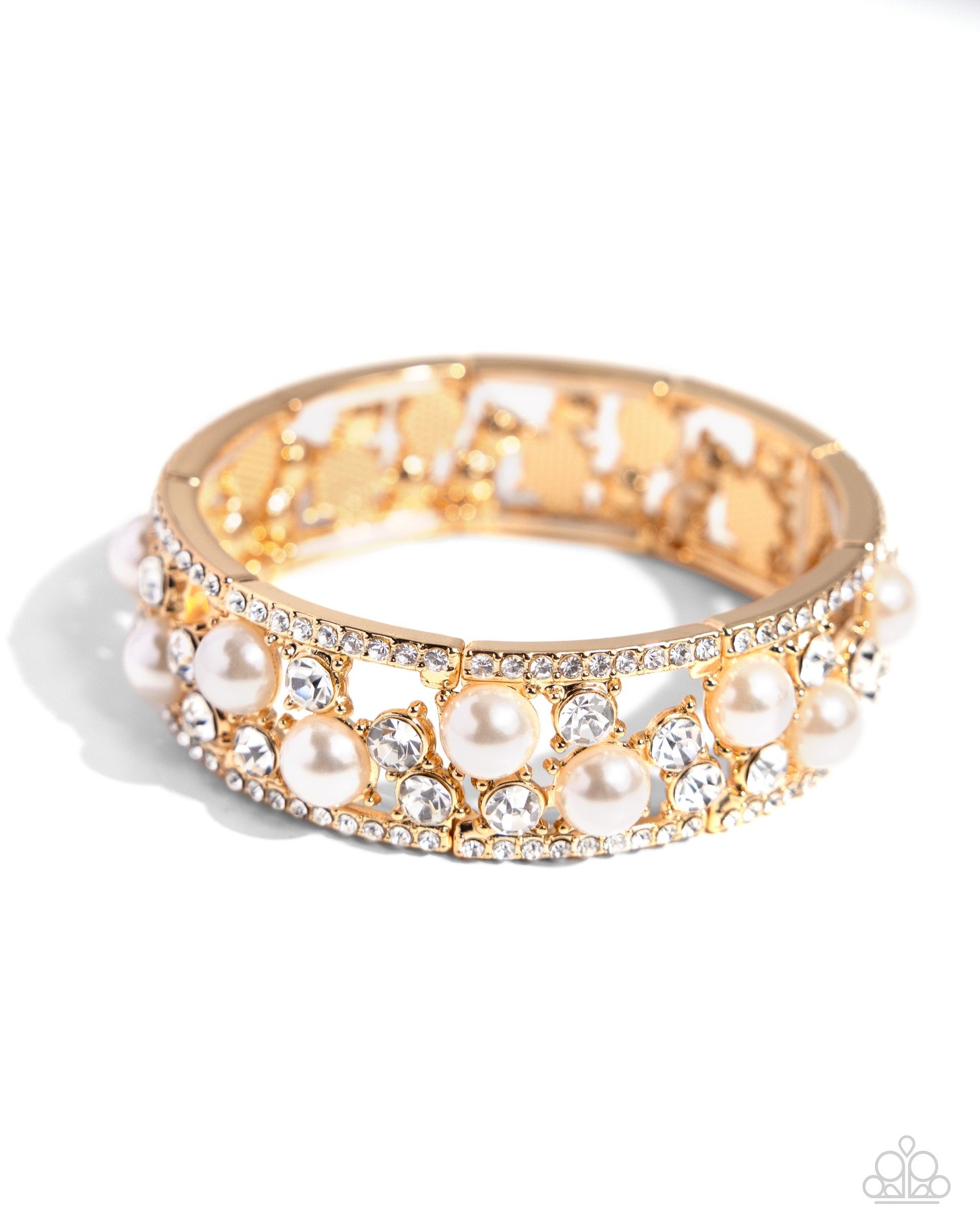 Opera Singer Gold Stretch Bracelet - Paparazzi Accessories  Set between white rhinestone-encrusted gold frames, a collection of white gems and white pearls set in gold-pronged fittings scatter and shimmer light around the wrist along elastic stretchy bands for an overly opulent display.  Sold as one individual bracelet.  P9RE-GDXX-421XX