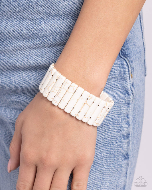 Southern Standing White Stone Stretch Bracelet - Paparazzi Accessories  Infused along elastic stretchy bands, a collection of rounded, white-marbled elongated stones wrap around the wrist for a southwestern statement. As the stone elements in this piece are natural, some color variation is normal.  Sold as one individual bracelet.  P9SE-WTXX-270XX