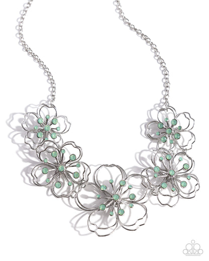 Wiry Wallflowers Green Flower Necklace - Paparazzi Accessories  Shiny silver wire delicately twists into layered blossoms with light green opalescent rhinestone floral centers. Varying in size, the airy floral frames delicately link into an asymmetrical display as the layered frames elegantly pop beneath the collar. Features an adjustable clasp closure.  Sold as one individual necklace. Includes one pair of matching earrings.  P2WH-GRXX-411XX