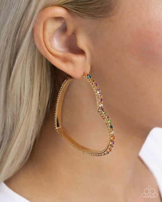 Halftime Hearts Gold Multi Hoop Earring - Paparazzi Accessories  Set in gold lace-like fittings, a collection of multicolored rhinestones curl around a gold heart frame for a feminine display. Earring attaches to a standard post fitting. Hoop measures approximately 2 1/2" in diameter.  Sold as one pair of hoop earrings.  P5HO-MTGD-110XX
