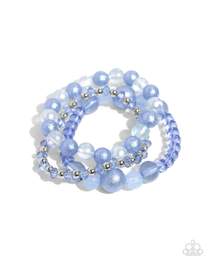 Shattered Stack Blue Stretch Bracelet - Paparazzi Accessories  Chambray Blue milky, clear, and glittery beads in varying sizes and faceted details combine with sleek silver beads along elastic stretchy bands for a colorful stack.  Sold as one set of three bracelets.  P9WH-BLXX-289ZE