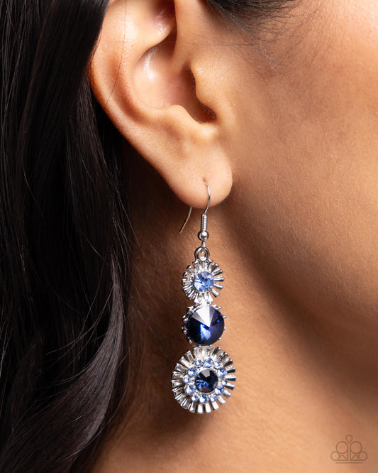 Dedicated Dalliance Blue Earring - Paparazzi Accessories  A trio of dazzling flared sunburst-inspired silver frames, each embellished with blue rhinestones and gems, brilliantly drip from the ear for a flawless finish. Earring attaches to a standard fishhook fitting.  Sold as one pair of earrings.  P5RE-BLXX-302XX