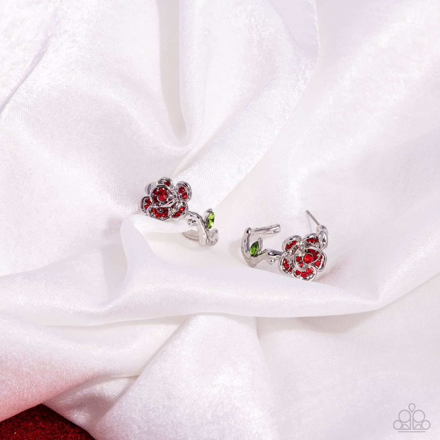 Mother ROSE Best Red Hoop Earring - Paparazzi Accessories  Featuring red rhinestones, a three-dimensional silver rose blooms atop a silver-vined hoop. A green marquise-cut gem adorns the vine for additional whimsical color. Earring attaches to a standard post fitting. Hoop measures approximately 3/4" in diameter.  Sold as one pair of hoop earrings.  P5HO-RDXX-035XX