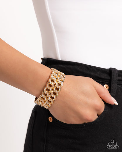 Braided Bandit Gold Hinge Bracelet - Paparazzi Accessories  Embellished with glistening white rhinestones, elongated gold curb chains stack atop one another to create a bold, stackable braided look along the wrist.  Sold as one individual bracelet.  P9ED-GDXX-076XX