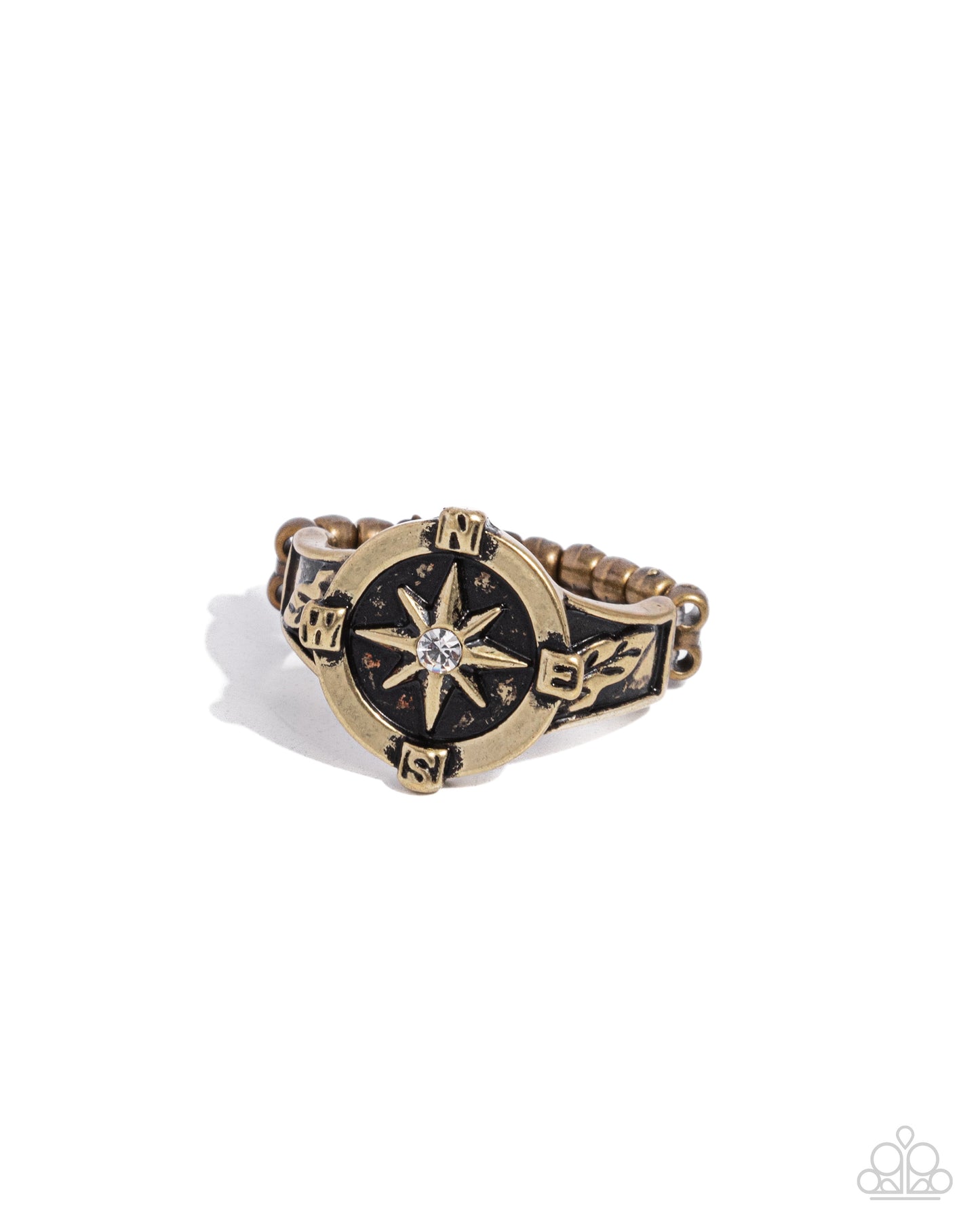 Cultured Compass Brass Ring - Paparazzi Accessories  Featuring a white rhinestone center, a circular compass-like brass pendant adorns the finger, creating an adventurous centerpiece. Brass leaves bloom from the brass compass for additional whimsical detail. Features a dainty stretchy band for a flexible fit.  Sold as one individual ring.  P4BA-BRXX-046XX