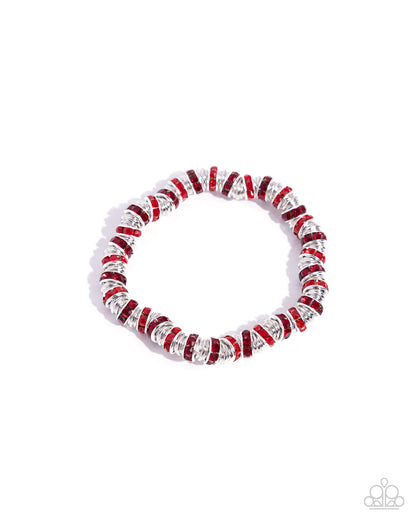 Radiant Roll Call Red Stretch Bracelet - Paparazzi Accessories  Embellished with glistening red and light red rhinestones, silver discs sporadically alternate along seemingly endless sleek, thin silver discs along the wrist on an invisible string for a burst of shimmer and glitz.  Sold as one individual bracelet.  P9RE-RDXX-164XX