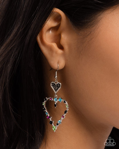 Parallel Passion Black Heart Earring - Paparazzi Accessories  Embellished in black rhinestones, a dainty silver heart gives way to a silver heart silhouette frame. Set in pronged silver fittings along the heart frame, multicolored gems and rhinestones in various shapes glitter for a bewitching display. Earring attaches to a standard fishhook fitting.  Sold as one pair of earrings.  P5RE-BKXX-469XX