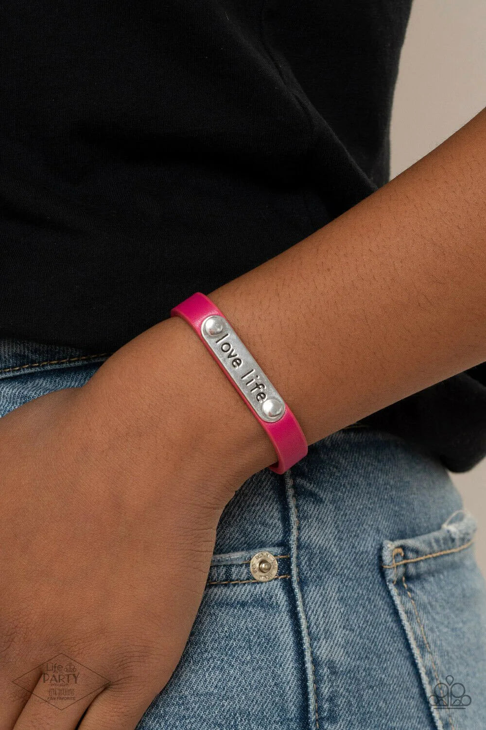 Love Life Pink Wrap Bracelet - Paparazzi Accessories  A silver plate engraved with the inspirational phrase “love life” is studded in place along a skinny strip of pink leather. Brushed in a shiny finish, the dainty band wraps around the wrist for a simple seasonal style. Features an adjustable snap closure.  Sold as one individual bracelet.