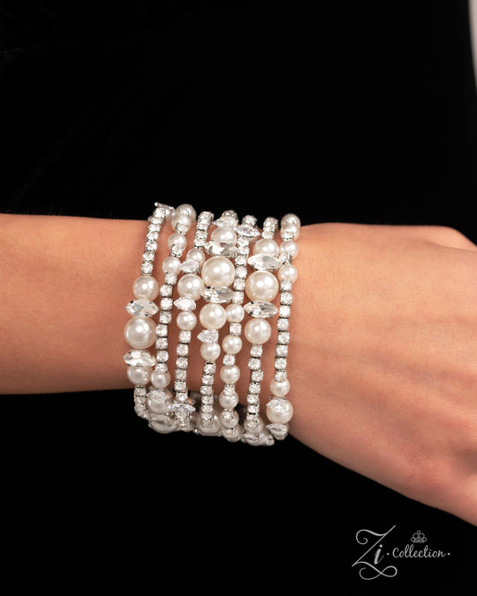 Sentimental Value White Pearl Coil Infinity Wrap Zi Bracelet - Paparazzi Accessories  Item #Z2422   Featuring various dazzling dimensions, a collection of glossy white pearls, elevated-pronged white teardrop and marquise-cut gems, and sparkling white gems in squared silver fittings is threaded along an invisible wire that coils around the wrist. Each flick of the wrist captures a different detail, showcasing the infinity wrap’s irresistible shimmer and range of refinement.  Sold as one individual bracelet.