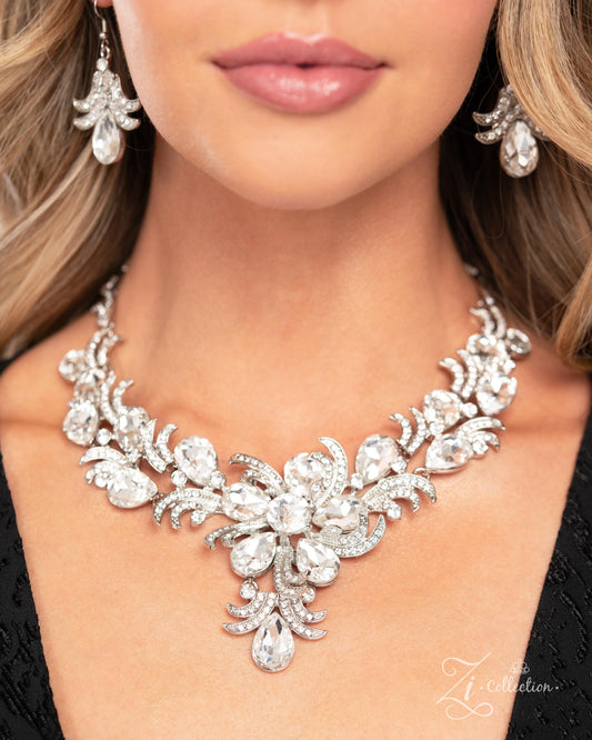 The Gesphania White Rhinestone 2024 Zi Necklace - Paparazzi Accessories  Item #Z2403  Curls of white rhinestone-embellished silver frames in varying sizes, and white teardrop gems bloom along the neckline, leading the eye to a shimmery luminescent floral centerpiece adorned in dizzying, intricate detail. An additional flourish of shimmery silver curls and a white teardrop gem cascades below the floral centerpiece, resulting in an unforgettable statement piece that sparkles with sentiment. Features an adjust