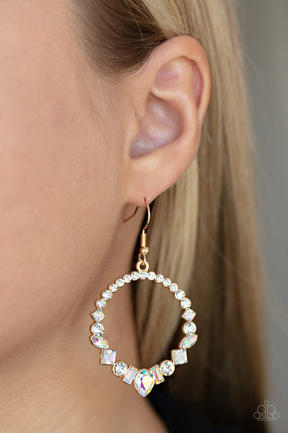 ﻿Revolutionary Refinement Gold Earring - Paparazzi Accessories  The bottom of a white rhinestone encrusted gold hoop is dotted in an intermix of classic white rhinestones and marquise and square cut iridescent gems, resulting in a stellar hoop. Earring attaches to a standard fishhook fitting.  Sold as one pair of earrings.