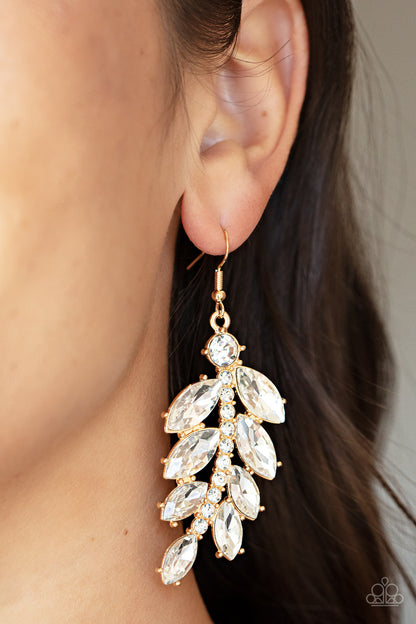 Ice Garden Gala Gold Earring - Paparazzi Accessories  Oversized marquise cut white rhinestones fan out from a curved gold bar encrusted in glassy white rhinestones, resulting into a glamorously leafy statement piece. Earring attaches to a standard fishhook fitting.  Sold as one pair of earrings.