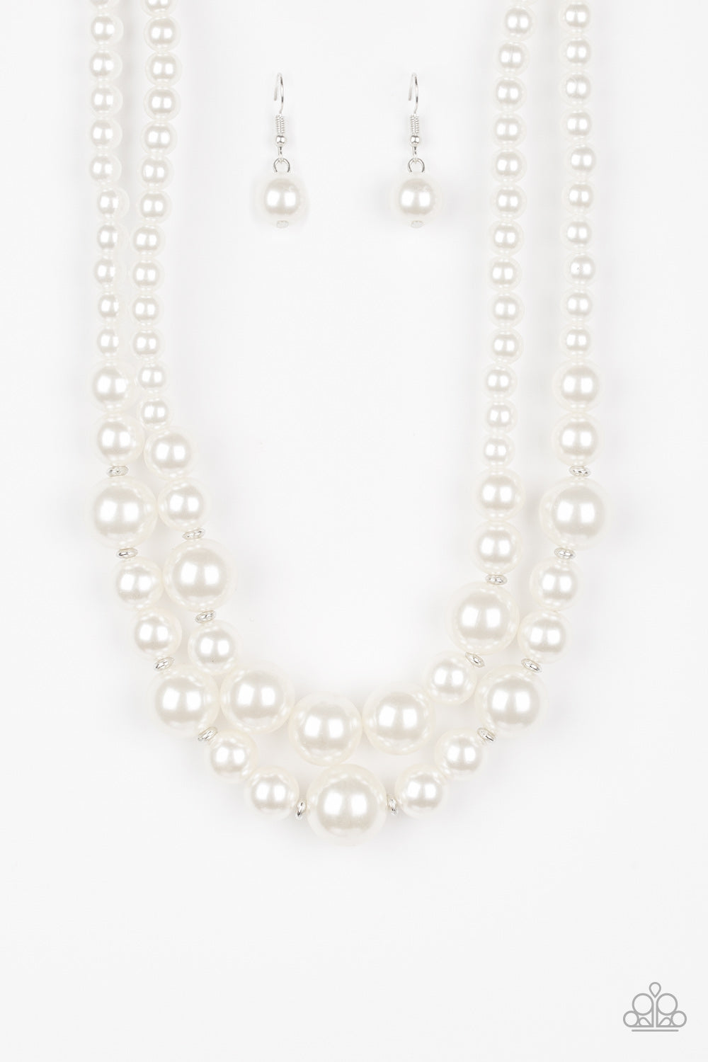 The More The Modest White Pearl Necklace - Paparazzi Accessories  Infused with dainty silver accents, classic white pearls layer below the collar in a timeless fashion. Features an adjustable clasp closure.  All Paparazzi Accessories are lead free and nickel free!   Sold as one individual necklace. Includes one pair of matching earrings.