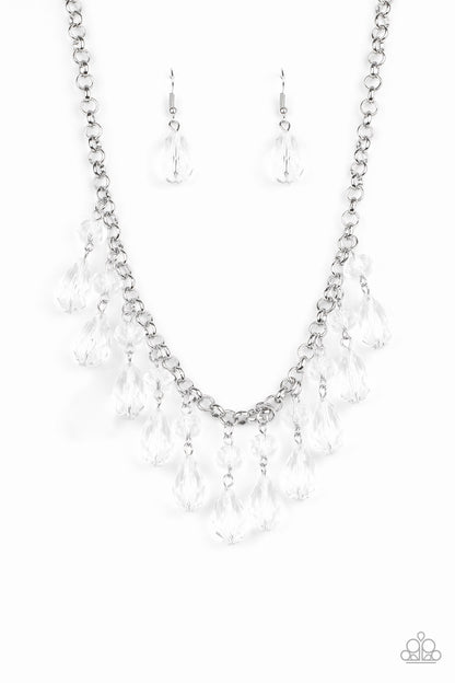 Crystal Enchantment White Necklace - Paparazzi Accessories  Featuring round and teardrop cuts, white crystal-like tassels dangle from the bottom of a shimmery silver chain, creating an enchanting fringe below the collar. Features an adjustable clasp closure. All Paparazzi Accessories are lead free and nickel free!  Sold as one individual necklace. Includes one pair of matching earrings.