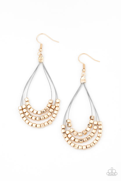 Off The Blocks Shimmer Gold Earring - Paparazzi Accessories  Three rows of dainty gold cube beads glides along shiny thin wire, layering into an edgy teardrop lure. Earring attaches to a standard fishhook fitting.  ﻿All Paparazzi Accessories are lead free and nickel free!  Sold as one pair of earrings.