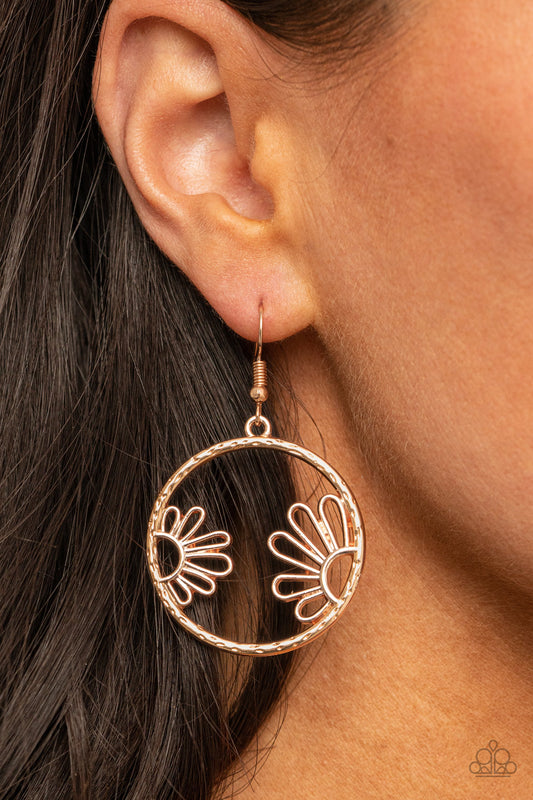 Demurely Daisy Rose Gold Earring - Paparazzi Accessories  A pair of airy daisies bloom inside a hammered rose gold hoop, creating a whimsically seasonal display. Earring attaches to a standard fishhook fitting.  All Paparazzi Accessories are lead free and nickel free!  Sold as one pair of earrings.