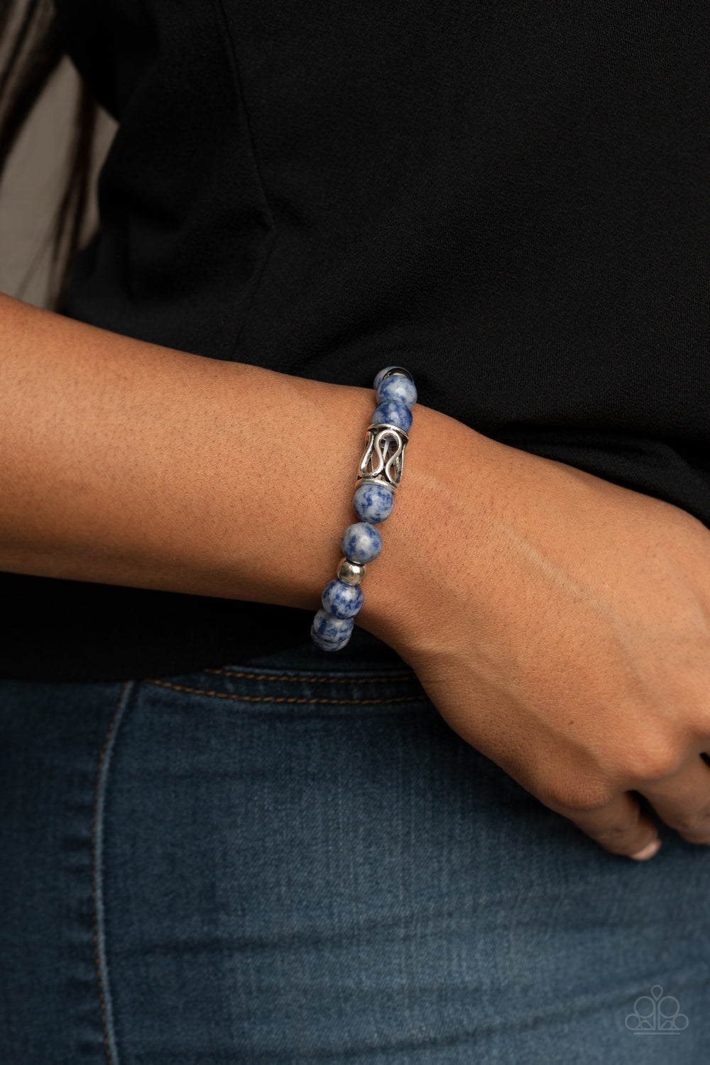 Soothes The Soul Blue Urban Bracelet - Paparazzi Accessories.  Infused with an ornate silver centerpiece, an earthy collection of silver and lapis lazuli beads are threaded along a stretchy band around the wrist for a seasonal flair.  ﻿﻿﻿All Paparazzi Accessories are lead free and nickel free!  Sold as one individual bracelet.