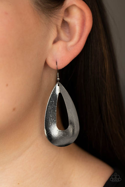 Hand It OVAL! Black Earring - Paparazzi Accessories  Delicately hammered in endless gunmetal shimmer, a flat glistening oval silhouette swings from the ear for a beautiful basic look. Earring attaches to a standard fishhook fitting.  ﻿All Paparazzi Accessories are lead free and nickel free!  Sold as one pair of earrings.