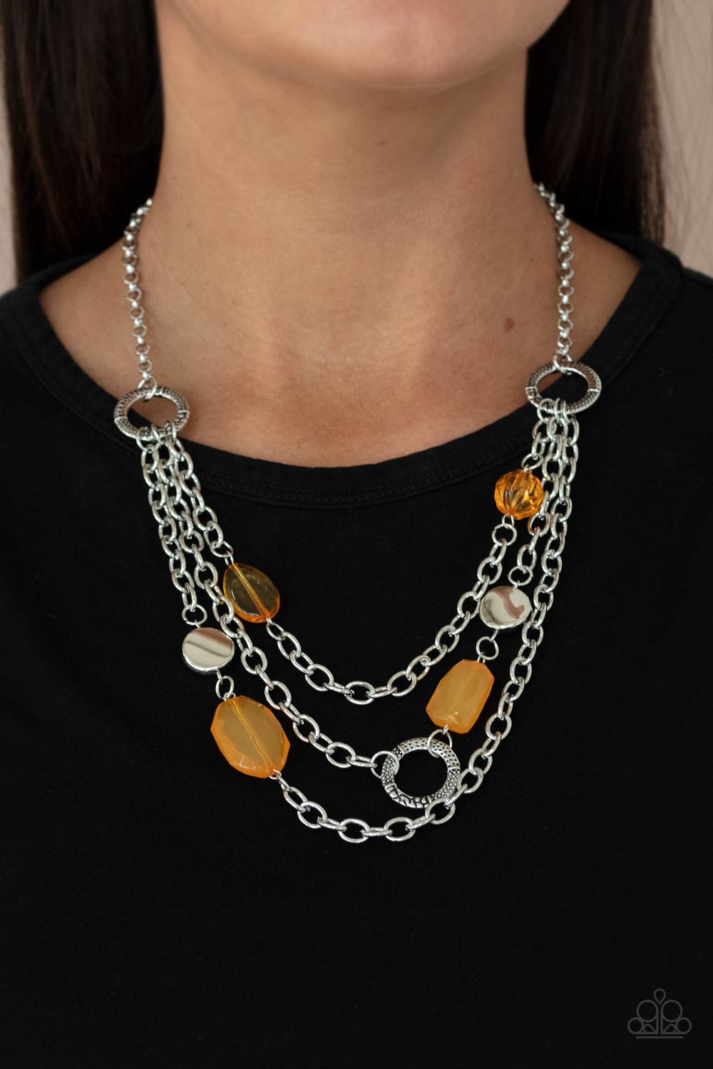 Oceanside Spa Orange Necklace - Paparazzi Accessories.  Varying in shape and opacity, glassy Marigold crystal-like beads, asymmetrical silver discs, and textured silver rings haphazardly adorn three silver chains below the collar for a whimsical pop of color. Features an adjustable clasp closure.  ﻿﻿﻿All Paparazzi Accessories are lead free and nickel free!  Sold as one individual necklace. Includes one pair of matching earrings.