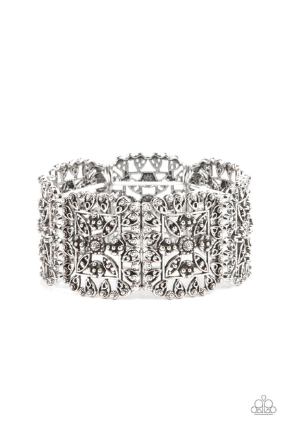 Enchanted Vineyards Silver Bracelet - Paparazzi Accessories.  Ornately studded leafy filigree delicately gathers into airy silver square frames that are threaded along stretchy bands around the wrist, creating a vintage inspired look.  ﻿All Paparazzi Accessories are lead free and nickel free!  Sold as one individual bracelet.