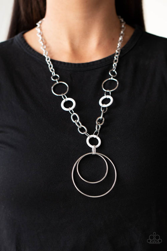 HOOP du Jour White Necklace - Paparazzi Accessories. Two generously sized hoops dangle from an oversized chain accented with small white acrylic hoops to create a playful pendant. Features an adjustable clasp closure.  All Paparazzi Accessories are lead free and nickel free!  Sold as one individual necklace. Includes one pair of matching earrings.