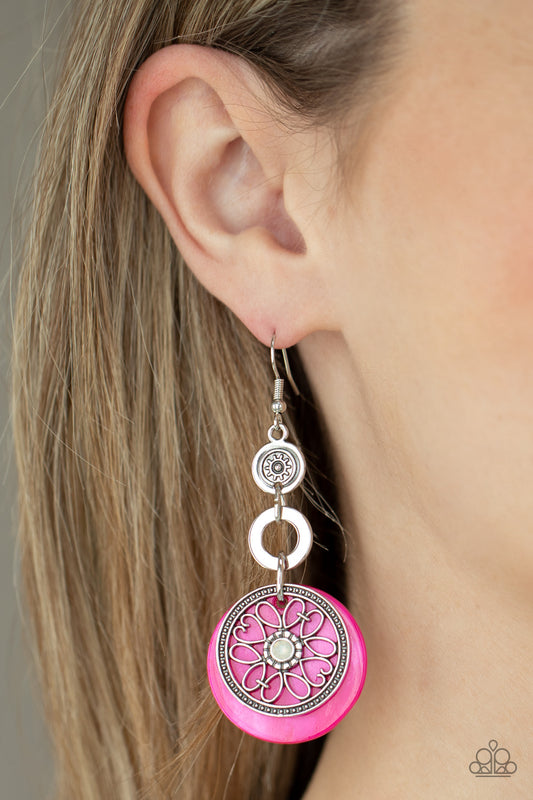 Royal Marina Pink Earring - Paparazzi Accessories.  Reminiscent of an eclipse, an airy silver ring radiating with ornate petals, sways in front of a pink shell-like disc. Silver rings in graduating sizes cascade from the top for a whimsically nautical look. Earring attaches to a standard fishhook fitting.  All Paparazzi Accessories are lead free and nickel free!  Sold as one pair of earrings.