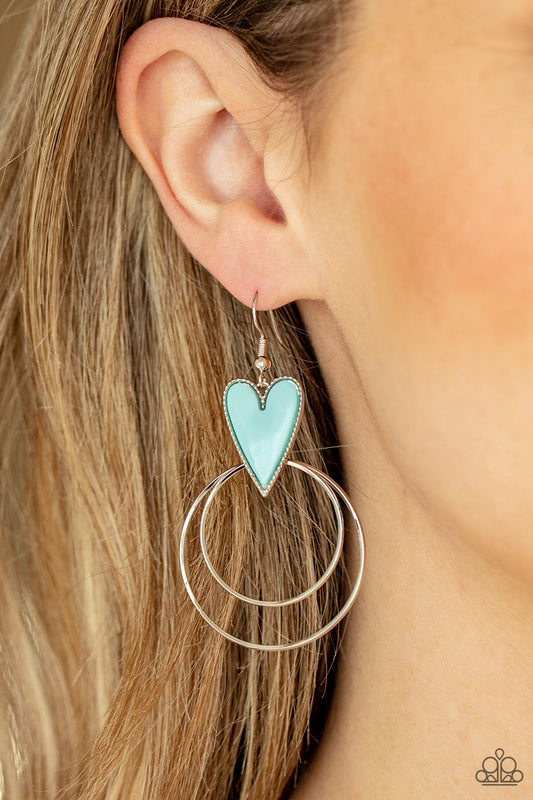 Happily Ever Hearts Blue Earring - Paparazzi Accessories  Dainty silver hoops attach to the bottom of a playful Cerulean heart frame, creating a flirtatious pop of color. Earring attaches to a standard fishhook fitting.  All Paparazzi Accessories are lead free and nickel free!  Sold as one pair of earrings.