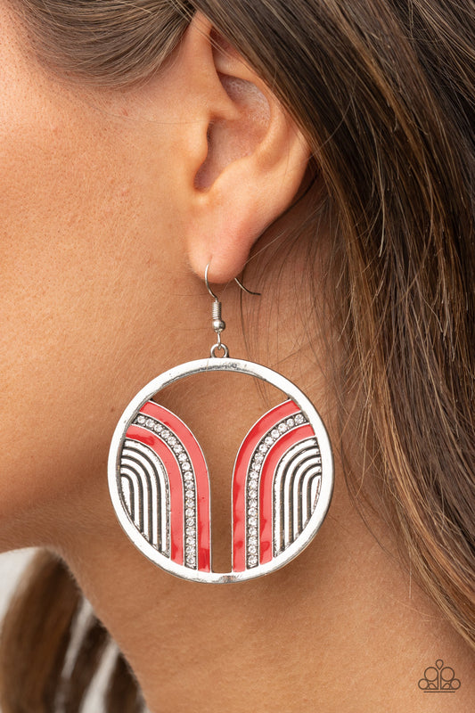 Delightfully Deco Red Earring - Paparazzi Accessories  Infused with a glittery row of white rhinestones, shiny red arcs curve into juxtaposed frames inside a classic silver hoop, creating a colorful art deco inspired centerpiece. Earring attaches to a standard fishhook fitting.  ﻿All Paparazzi Accessories are lead free and nickel free!  Sold as one pair of earrings.