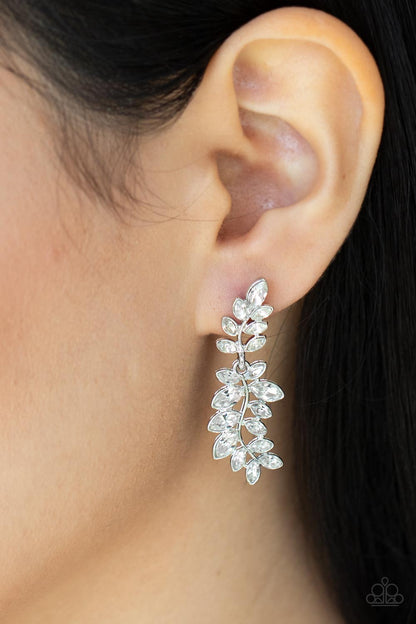 Frond Fairytale White Post Earring - Paparazzi Accessories  Dotted with dainty white rhinestones, two leafy silver frames delicately link into a twinkly trestle for a timeless finish. Earring attaches to a standard post fitting.  Sold as one pair of post earrings.