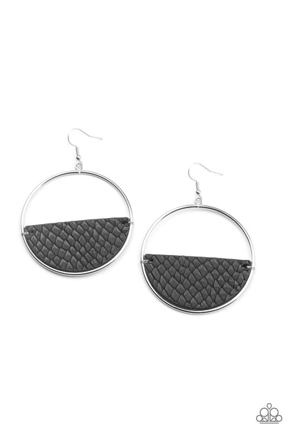 Animal Aesthetic Black Leather Earring - Paparazzi Accessories  Featuring a python print, a half moon piece of rustic black leather is fitted in place along the bottom of an oversized silver hoop for a wonderfully wild look. Earring attaches to a standard fishhook fitting.   Sold as one pair of earrings.