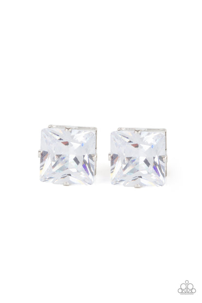 Times Square Timeless White Earring - Paparazzi Accessories  A stunning oversized square rhinestone, set in a classic silver pronged fitting, makes a show-stopping impact as it shines brilliantly and draws attention up to the face. Earring attaches to a standard post fitting.  All Paparazzi Accessories are lead free and nickel free!  Sold as one pair of post earrings.