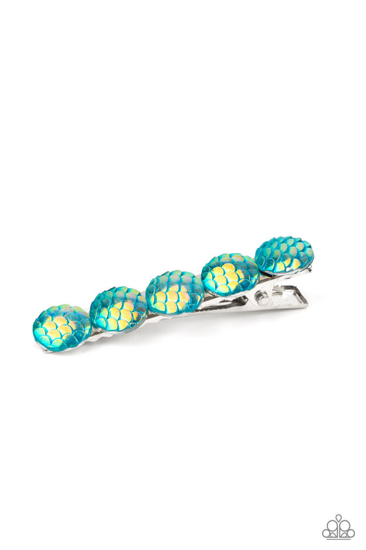 Mesmerizingly Mermaid Blue Hair Clip - Paparazzi Accessories  Brushed in an iridescent finish, a row of blue scale-like beads adorn the front of a rectangular silver frame for a Mer-mazing finish. Features a standard hair clip on the back.  All Paparazzi Accessories are lead free and nickel free!   Sold as one individual hair clip.