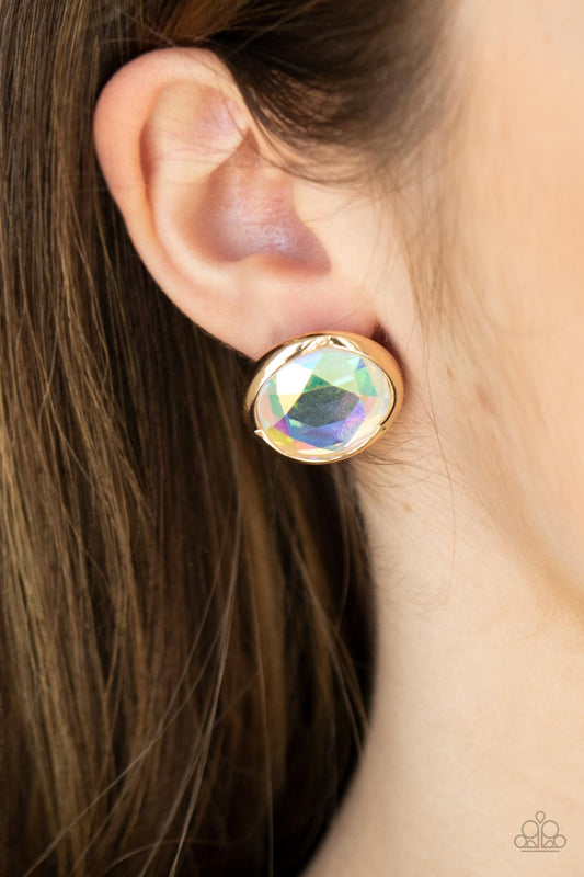 Double-Take Twinkle Gold Post Earring - Paparazzi Accessories  Featuring a flashy faceted finish, an oversized iridescent gem is pressed into a sleek gold fitting for a dramatic pop of dazzle. Earring attaches to a standard post fitting.  Sold as one pair of post earrings.