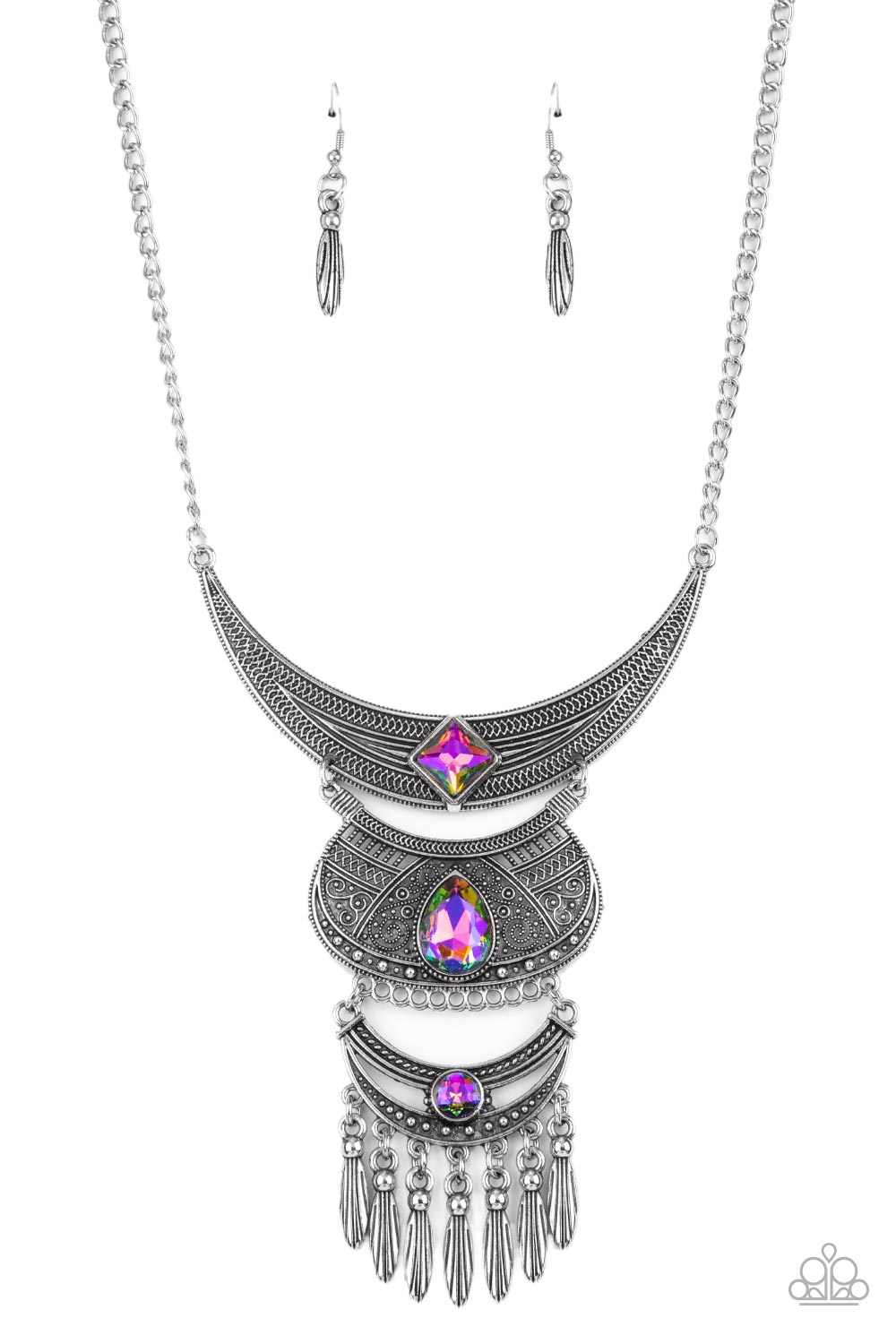 Lunar Enchantment Multi Necklace - Paparazzi Accessories  Embossed in studded, geometric, and paisley filigree-like patterns, three mismatched silver half moon plates dramatically link below the collar. Featuring an iridescent UV shimmer, an oversized collection of square, teardrop, and round rhinestones embellish the decorative silver frames, while a silver beaded fringe swings from the lowermost plate for a noisemaking finish. Features an adjustable clasp closure.  Includes one pair of matching earrings.