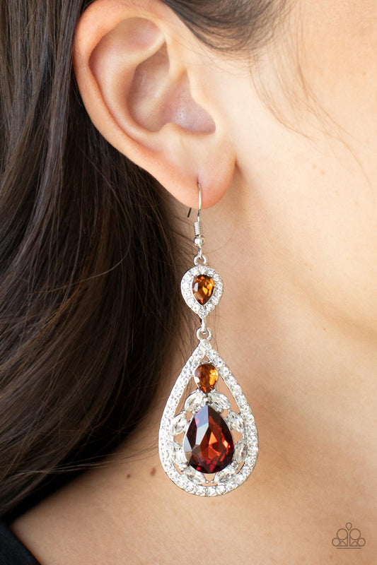 Posh Pageantry Brown Earring - Paparazzi Accessories  Three teardrop topaz rhinestones adorn white rhinestone encrusted silver frames that link into an elegant teardrop lure for a flawless fashion. Earring attaches to a standard fishhook fitting.  Sold as one pair of earrings.