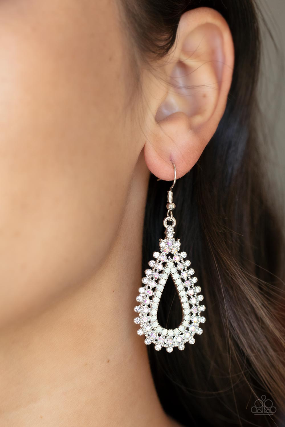 The Works Multi Earring - Paparazzi Accessories  Glittery rows of white, iridescent, and opal rhinestones stack into a solitaire sparkly teardrop frame for a glamorous fashion. Earring attaches to a standard fishhook fitting.  Sold as one pair of earrings.