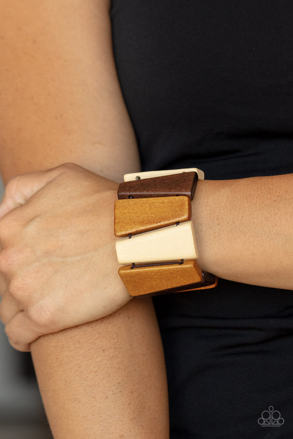 Barbados Backdrop Multi Wood Bracelet - Paparazzi Accessories  Tinted in various shades of brown, chunky triangular wooden frames are threaded along stretchy bands around the wrist for an earthy look.  Sold as one individual bracelet.