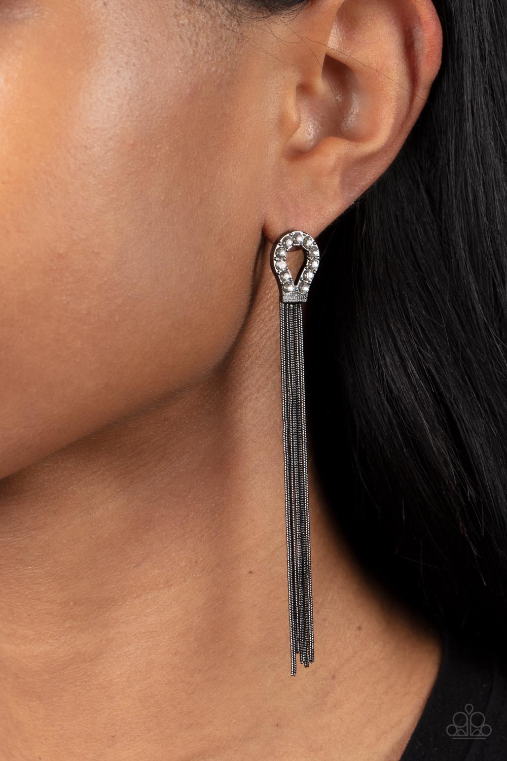 Dallas Debutante Black Earring - Paparazzi Accessories  A glistening curtain of round gunmetal snake chains stream out from the bottom of a dainty horseshoe frame adorned in glassy white rhinestones, creating a tantalizing tassel. Earring attaches to a standard post fitting.  Sold as one pair of post earrings.