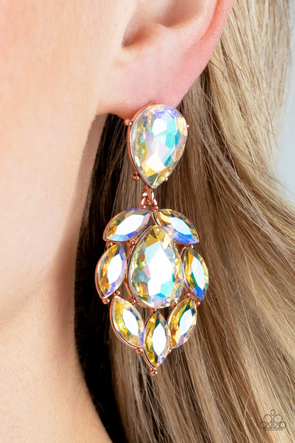 Galactic Go-Getter Copper Earring - Paparazzi Accessories  A stellar collection of marquise cut iridescent rhinestones nestle around an oversized teardrop iridescent rhinestone, creating a dramatically stellar display at the bottom of a matching iridescent teardrop rhinestone. Earring attaches to a standard post fitting.  Sold as one pair of post earrings.