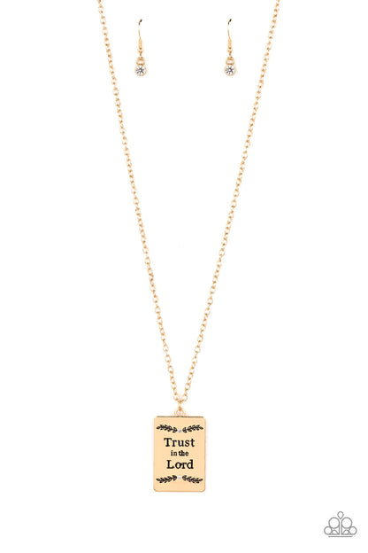 All About Trust Gold Necklace - Paparazzi Accessories  Bordered in leafy patterns and dainty white rhinestones, the center of a gold rectangular frame is stamped in the phrase, "Trust in the Lord," for an inspiring finish. Features an adjustable clasp closure.  Sold as one individual necklace. Includes one pair of matching earrings.