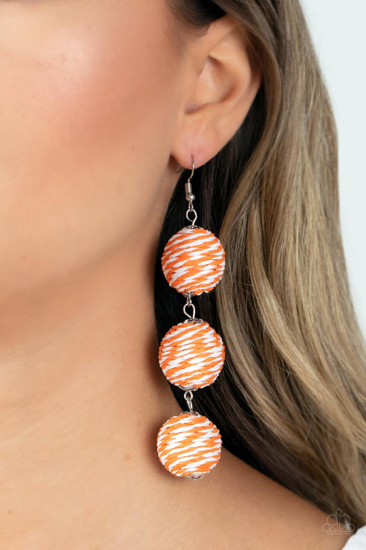 Laguna Lanterns Orange Earring - Paparazzi Accessories  A woven collection of orange and white crepe-like strings ornately wraps around three hanging beads, reminiscent of decorative party lanterns. Earring attaches to a standard fishhook fitting.  Sold as one pair of earrings.