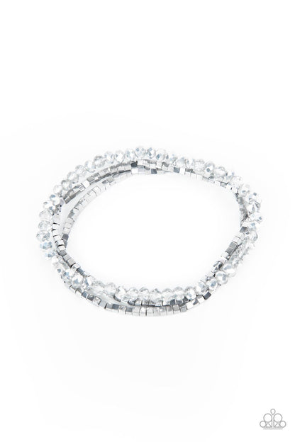 Just a Spritz Silver Bracelet - Paparazzi Accessories  Two rows of dainty silver cube beads and one row of smoky crystal-like beads are threaded along stretchy bands around the wrist, creating stellar layers.  Sold as one set of three bracelets.