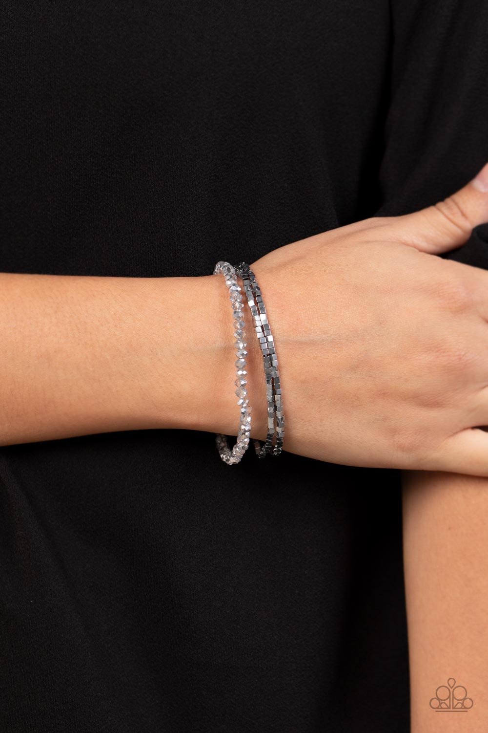 Just a Spritz Silver Bracelet - Paparazzi Accessories  Two rows of dainty silver cube beads and one row of smoky crystal-like beads are threaded along stretchy bands around the wrist, creating stellar layers.  Sold as one set of three bracelets.