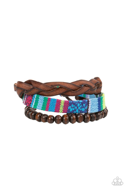 Textile Texting Blue Urban Bracelet - Paparazzi Accessories  An earthy compilation of wooden beads, braided leather, and colorful textile fabric layers around the wrist for an adventurous fashion. Features an adjustable sliding knot closure.  Sold as one individual bracelet.