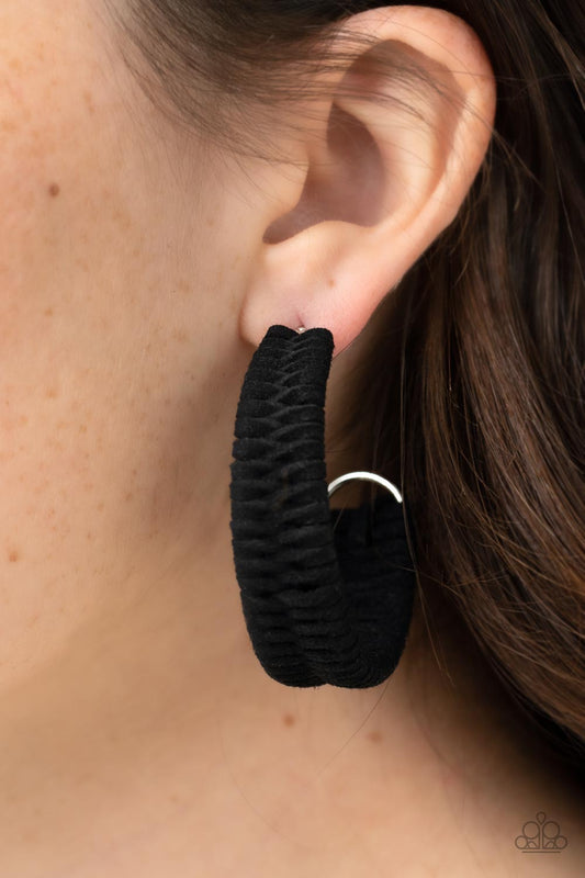 Rural Guru Black Hoop Earring - Paparazzi Accessories  Black suede cording crisscrosses around a layered silver frame that widens as it curves into a simple hoop, creating a textured handcrafted design. Hoop measures approximately 2" in diameter. Earring attaches to a standard post fitting.  Sold as one pair of hoop earrings.