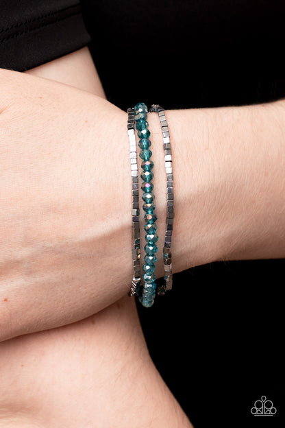 Just a Spritz Blue Bracelet - Paparazzi Accessories  Two rows of dainty silver cube beads and one row of iridescent blue crystal-like beads are threaded along stretchy bands around the wrist, creating stellar layers.  Sold as one set of three bracelets.